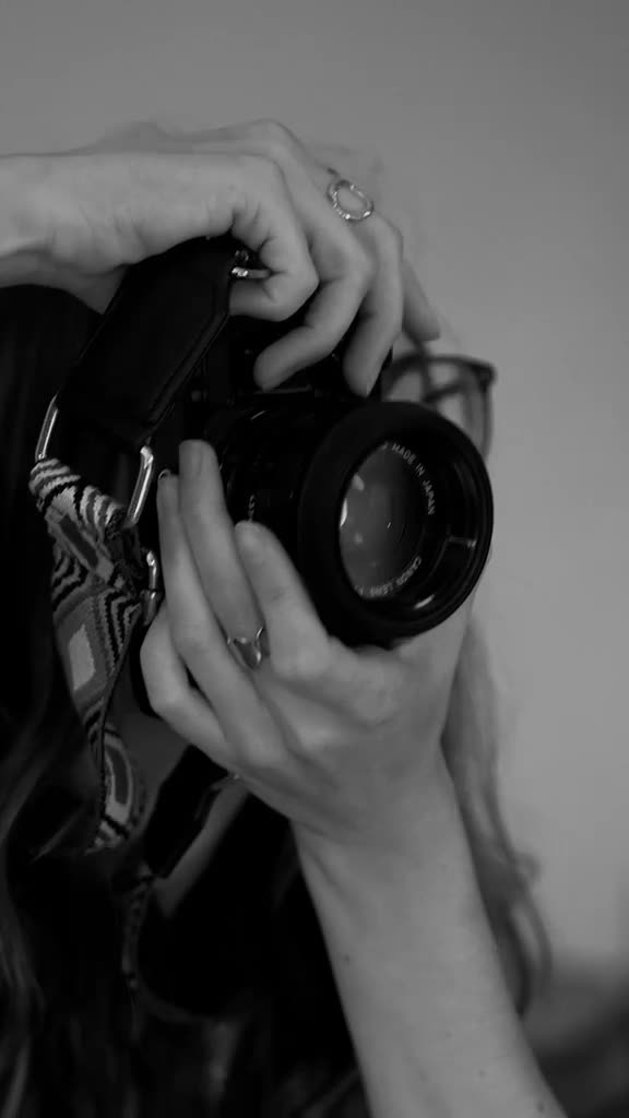 A camera held ready on a shoot.