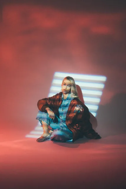 A portrait with coloured light projected across the subject.