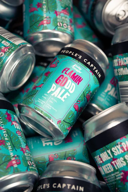 A close-up of People's Captain Flamin Good Pale cans.
